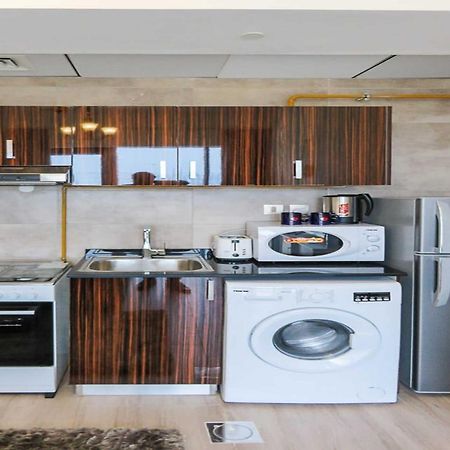 OYO 860 Studio Apartment, Maya Tower 4, Jumeirah Village Triangle Dubai Bagian luar foto