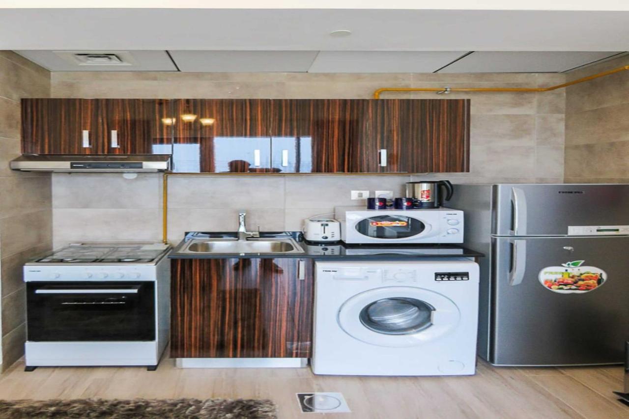 OYO 860 Studio Apartment, Maya Tower 4, Jumeirah Village Triangle Dubai Bagian luar foto