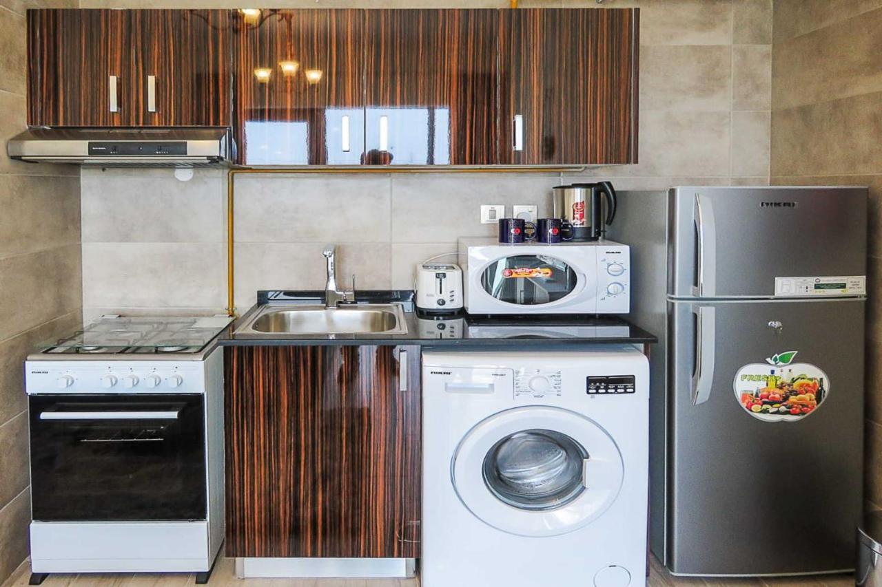 OYO 860 Studio Apartment, Maya Tower 4, Jumeirah Village Triangle Dubai Bagian luar foto